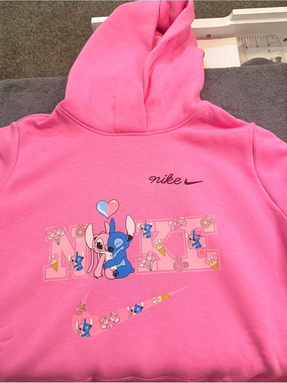 Nike Women’s Pink Stitch Graphic Hoodie